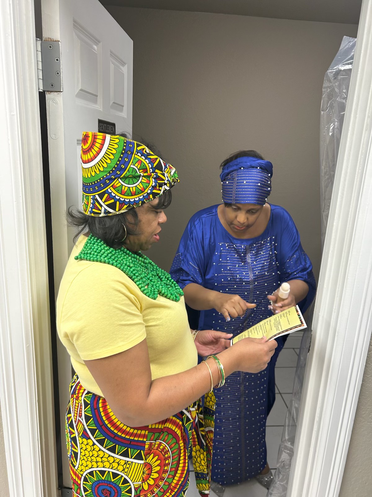 Kesha and LaTonya discussing the program outline at Styled by the Legacy